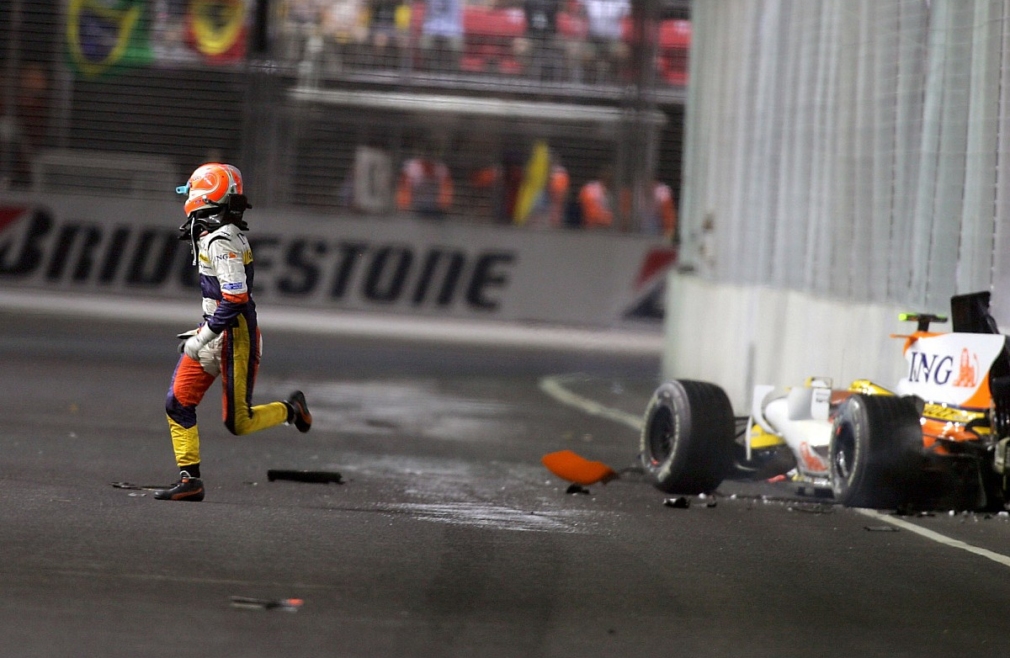 Nelson Piquet Junior escaping from his crashed Renault during the 2008 Singapore Grand Prix