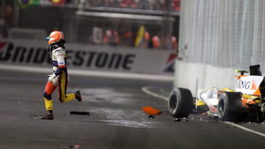 Nelson Piquet Junior escaping from his crashed Renault during the 2008 Singapore Grand Prix