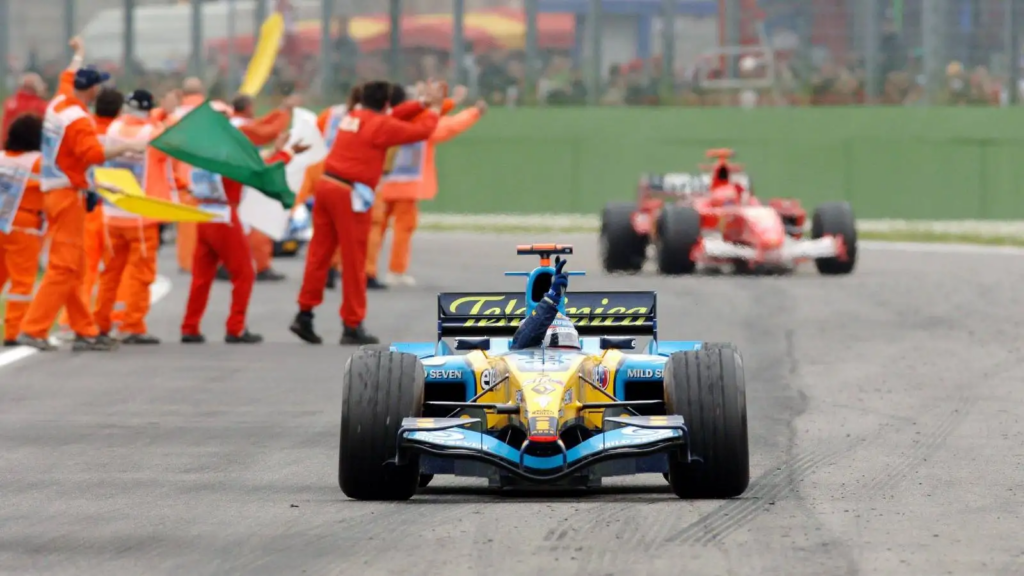 Fernando Alonso waves from his Renault after taking the win at the 2005 San Marino Grand Prix